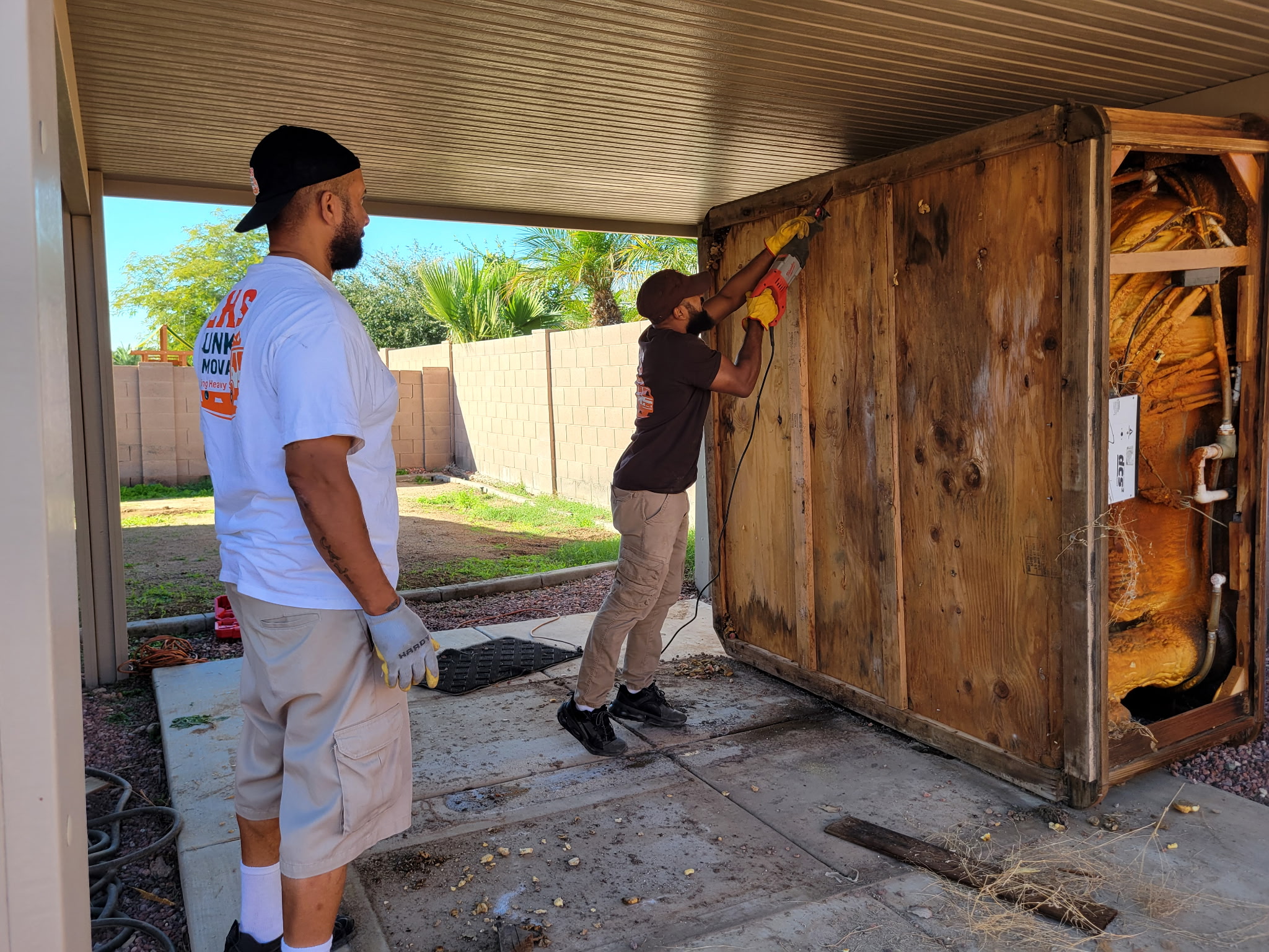 Men disassembling things