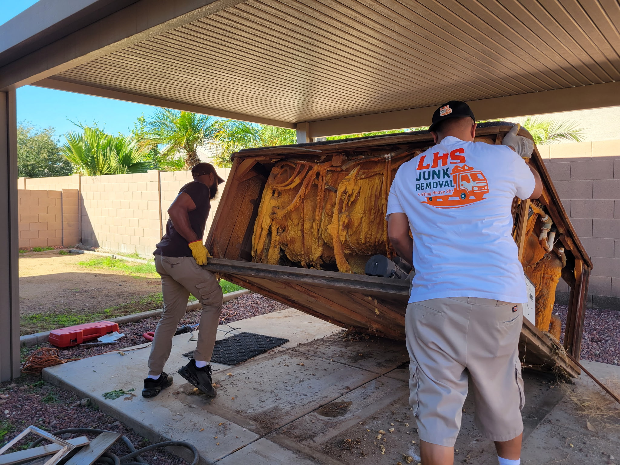 Men disassembling things